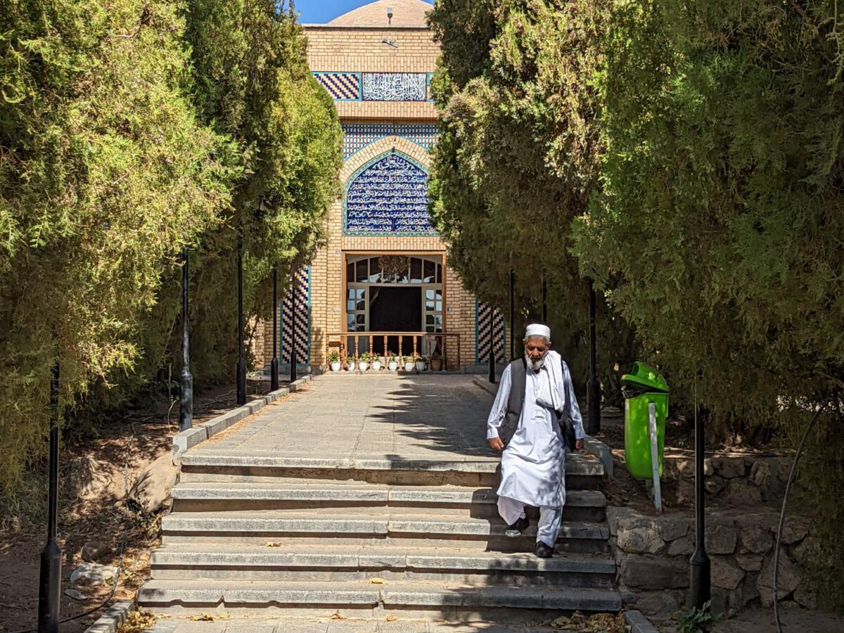 Pilgrim descending the steps at Kharaqan shrine, Iran